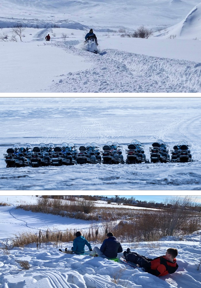 Winter at Three Peaks Lodge — snowmobile powder, parked sleds, and a day in the snow